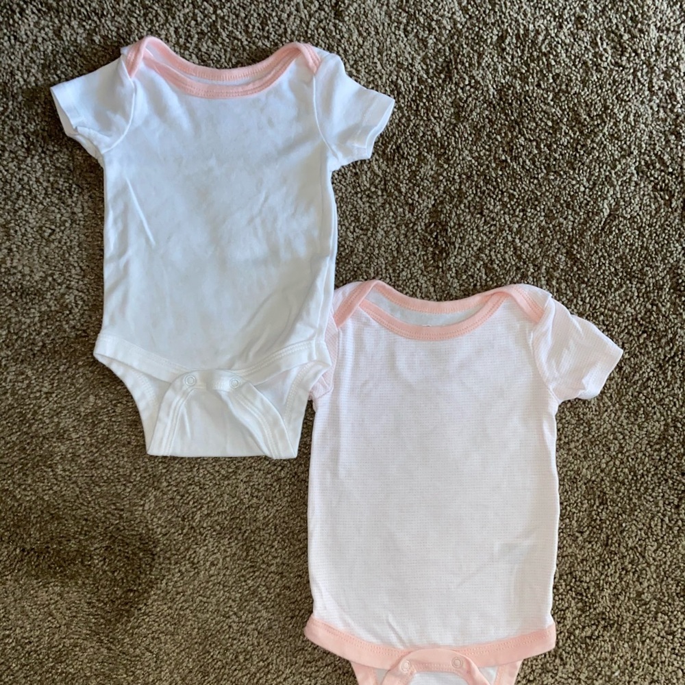 Light pink and white baby girl onsies